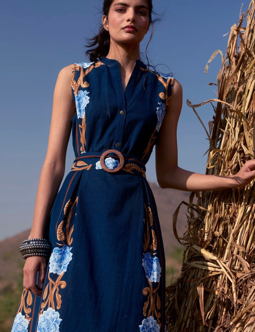 Back view of the Harvest Navy Iris Dress, a sleeveless navy midi shirt dress