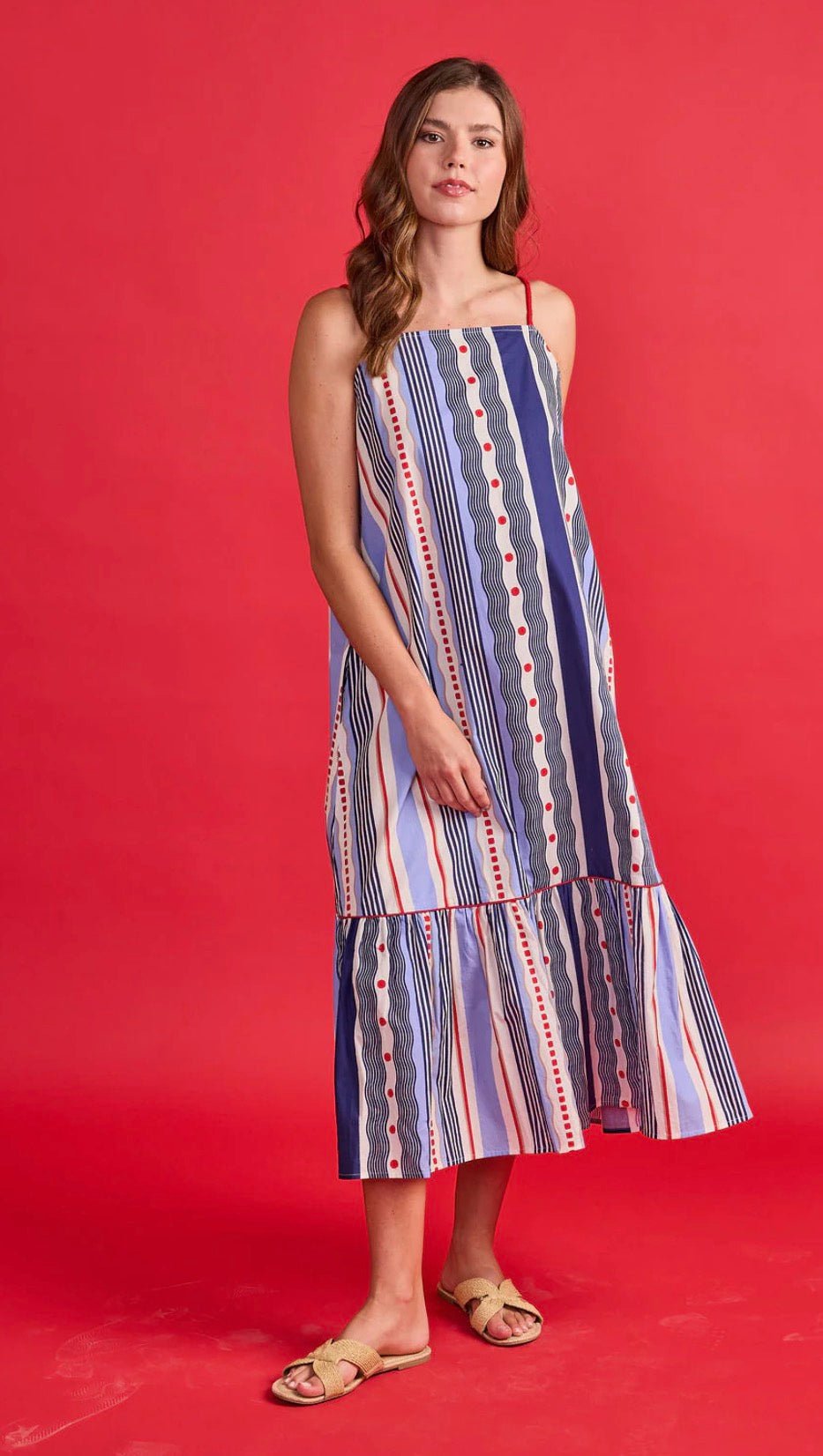 Vera Dress, a navy and periwinkle mixed stripe dress, worn front view