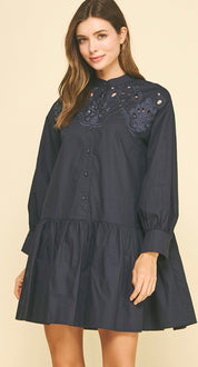 Back view of the Embroidered Navy Mini Dress, a navy poplin mini with embroidered yoke