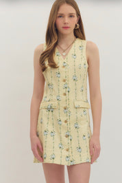 Lemon Yellow Floral Dress styled full length, a pastel yellow dress with blue floral sprigs