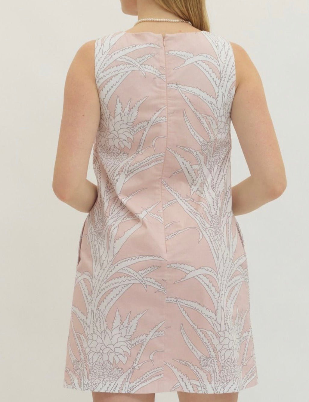 Back view of the Pink Paradise Mini Dress, a pink A-line shift mini