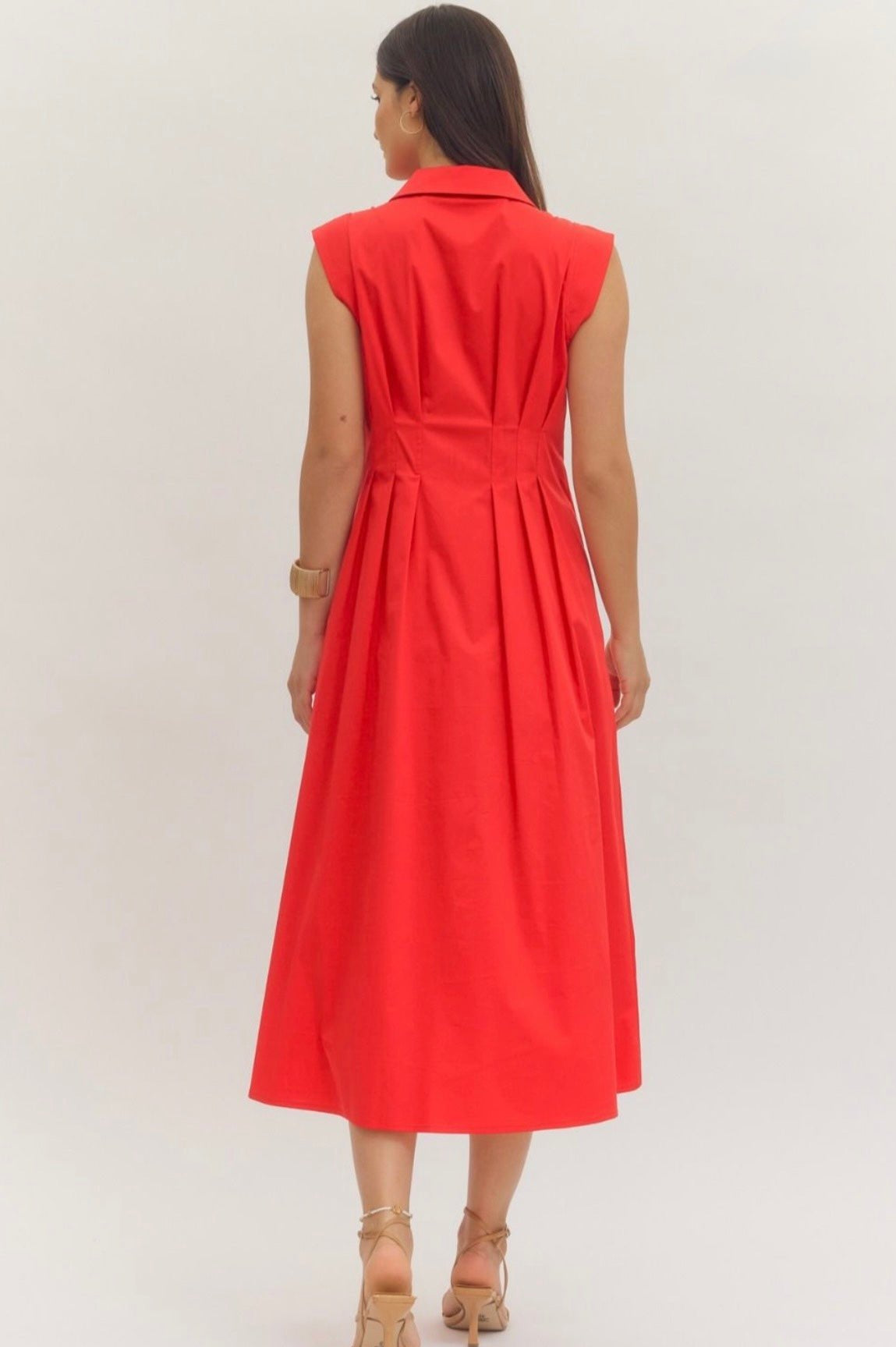 Close-up of the pleated waist and front zipper on the Firecracker Red Maxi Dress
