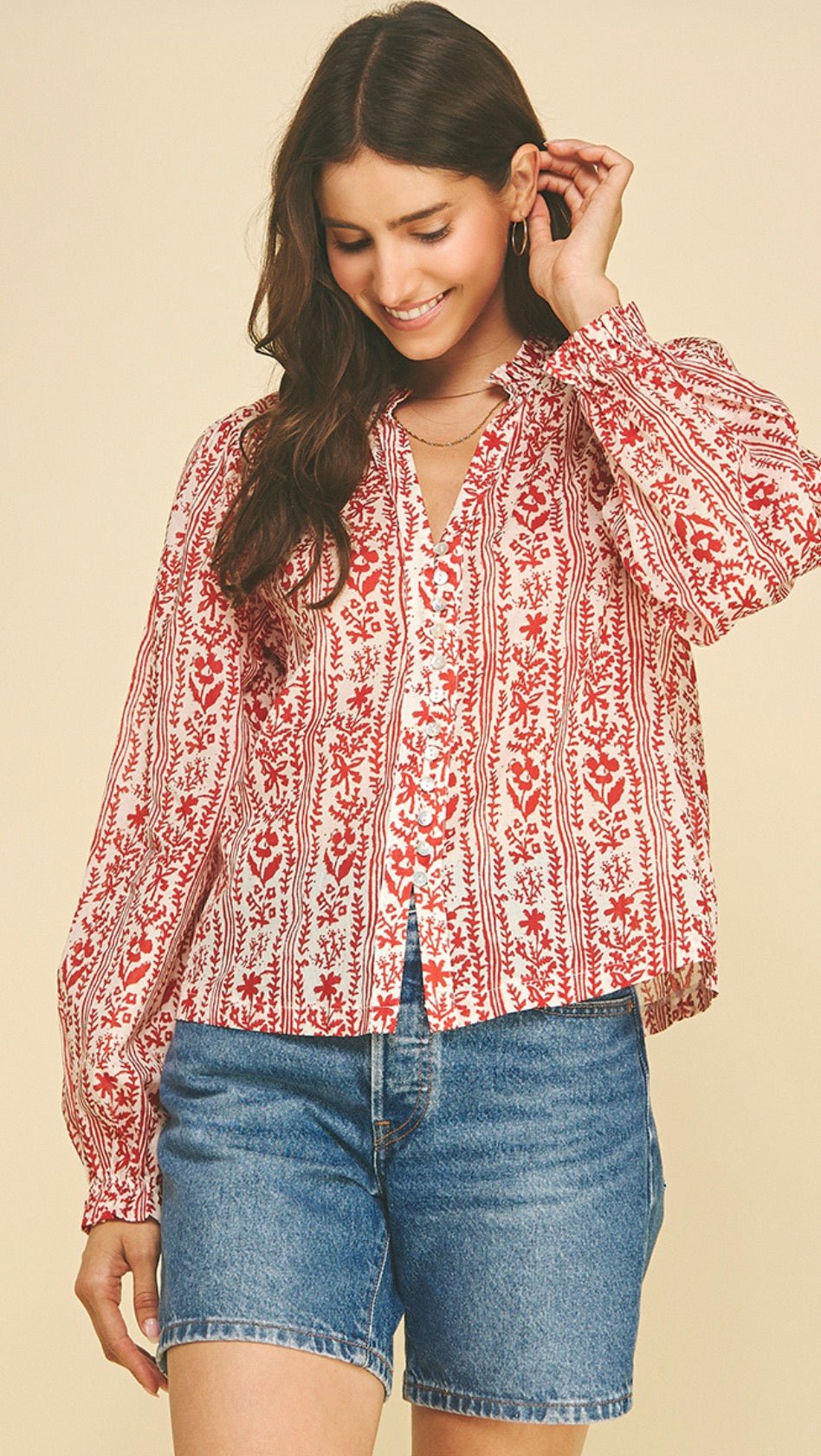 Back view of the Red Bubble Top, a red floral block-print bubble blouse