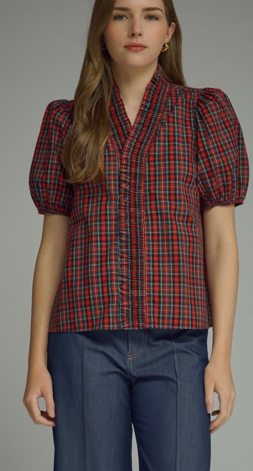 Holiday Magic Top, a red and navy plaid ruffle blouse, worn front view