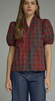 Holiday Magic Top, a red and navy plaid ruffle blouse, worn front view