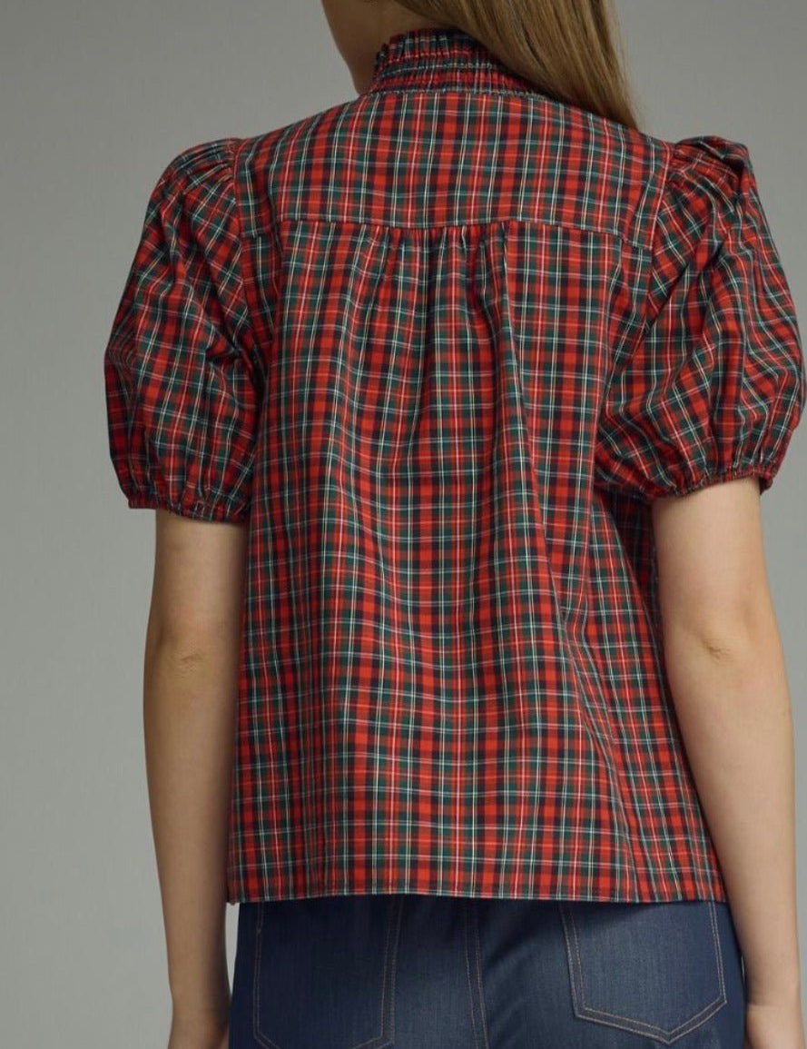 Back view of the Holiday Magic Top, a red and navy plaid ruffle blouse