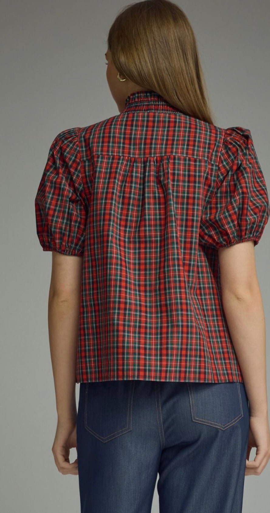 Back view of the Holiday Magic Top, a red and navy plaid ruffle blouse
