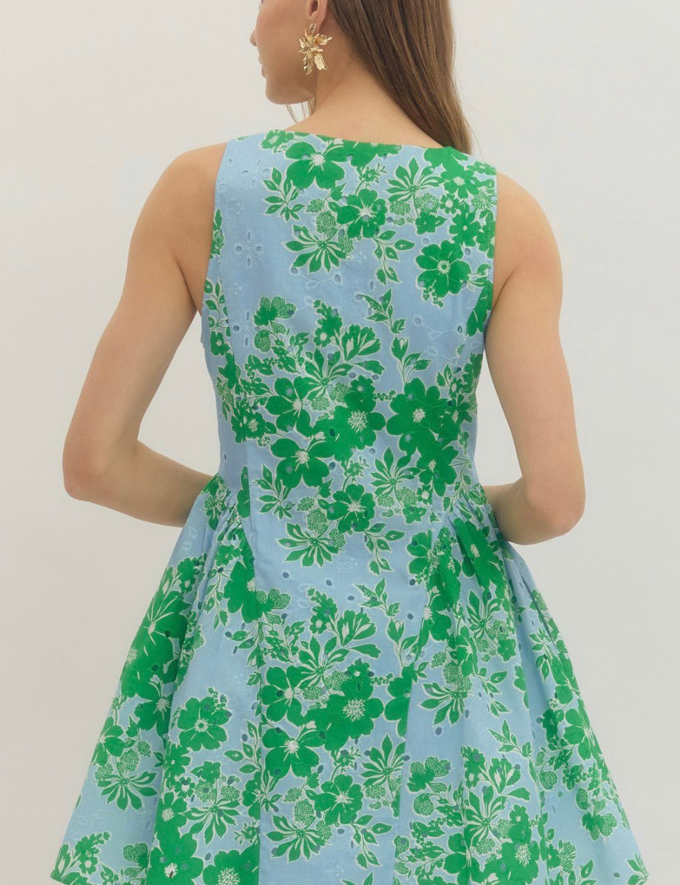 Back view of the Garden Party Dress, a sky blue dress with emerald floral print – Lady & Tucker