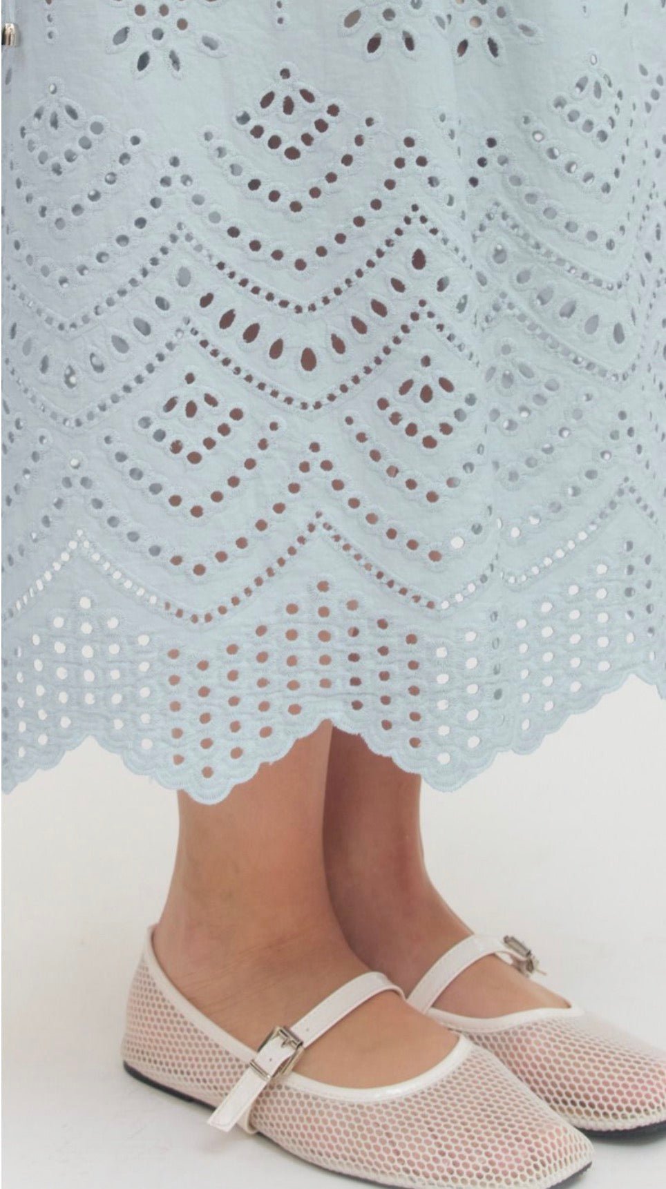 Sky Blue Eyelet Skirt shown on model, another view of a light blue eyelet midi skirt – Lady & Tucker