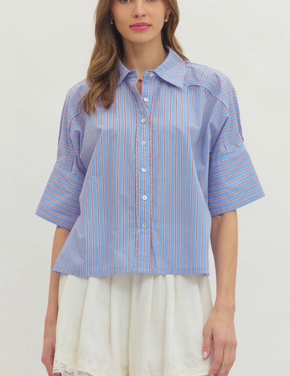 Blue Preppy Top, a sky blue pinstripe button-down, worn front view