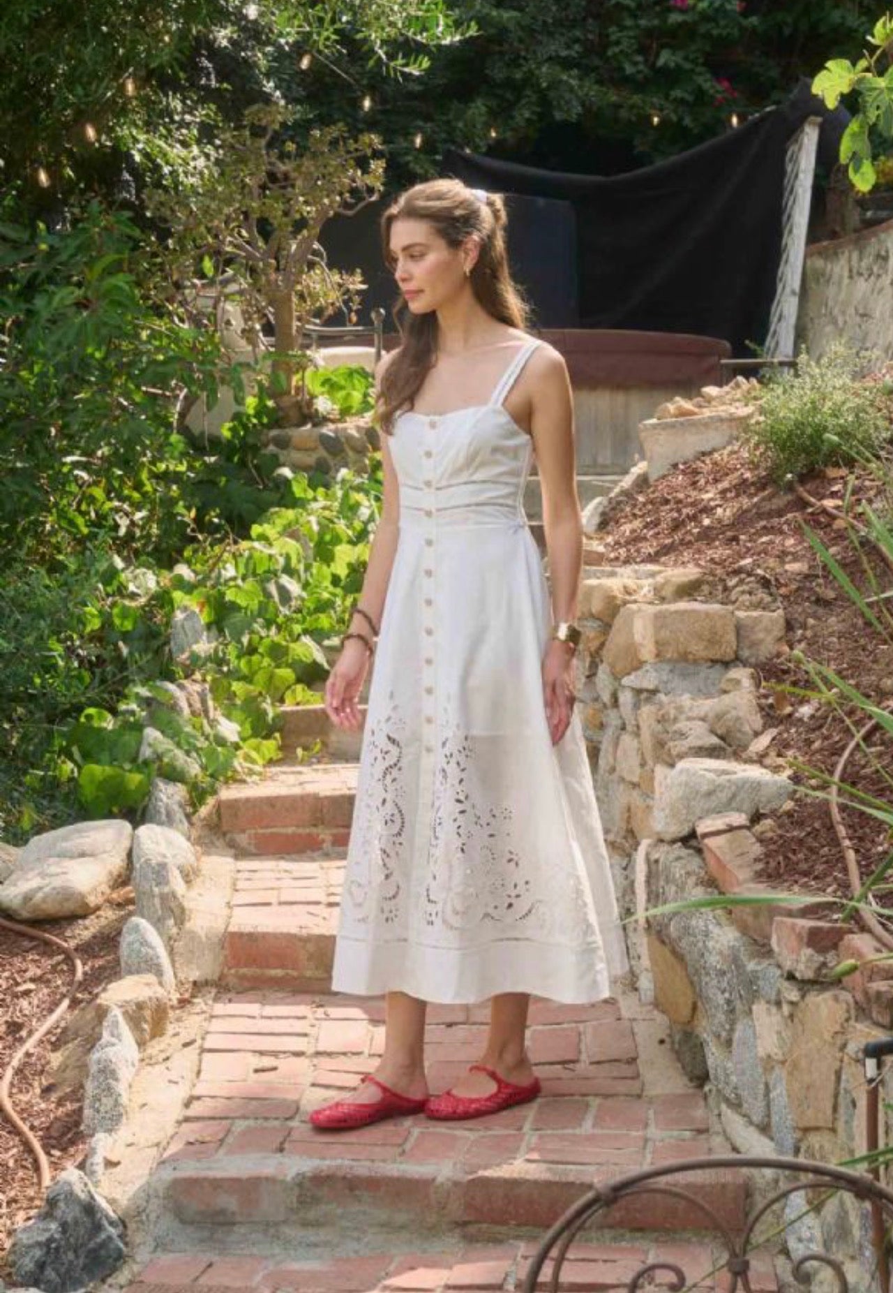 Back view of the Sleeveless Eyelet Midi Dress, a sleeveless eyelet midi dress