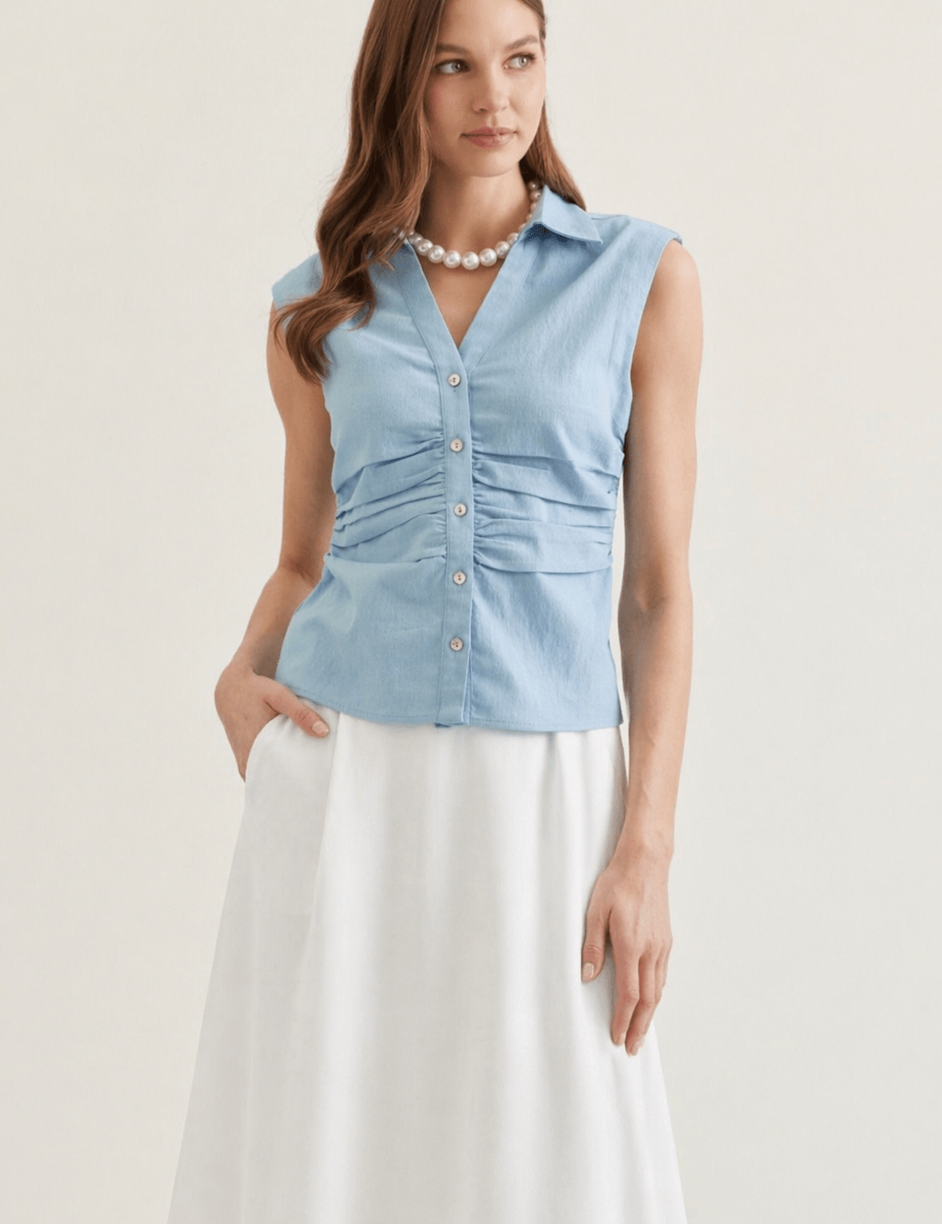 Denim Top, a sleeveless button-front denim top, worn front view