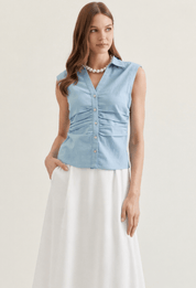 Denim Top, a sleeveless button-front denim top, worn front view
