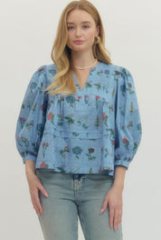 Chambray Floral Top, a soft blue floral empire waist blouse, worn front view
