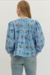 Back view of the Chambray Floral Top, a soft blue floral empire waist blouse – Lady & Tucker