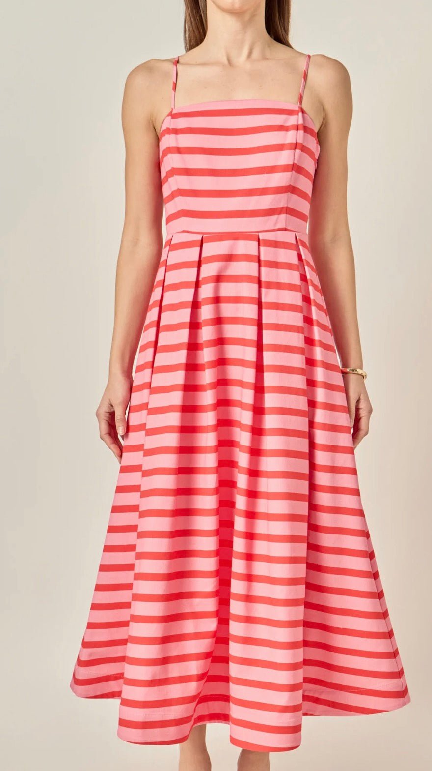 Back view of the Pretty In Stripes Dress, a striped pleated midi with spaghetti straps