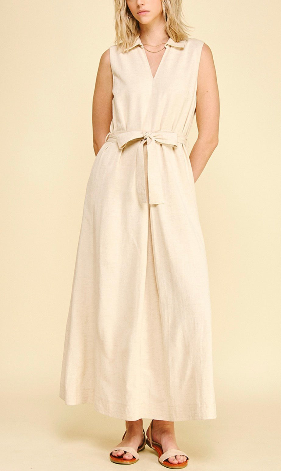 Linen Maxi Dress, a sleeveless tan linen maxi dress, worn front view