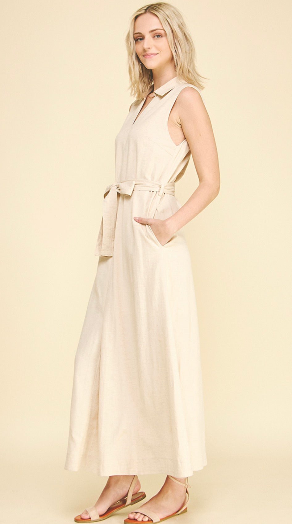 Back view of the Linen Maxi Dress, a sleeveless tan linen maxi dress
