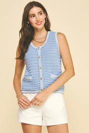 Back view of the Tweed Sweater Top, a tweed-style knit top with metal buttons