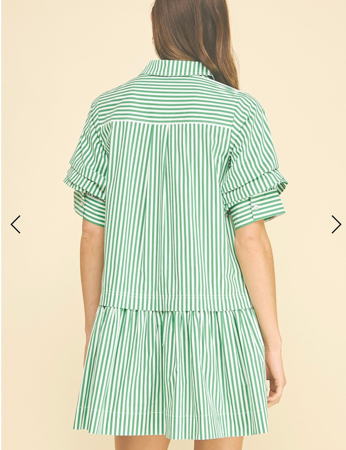 Side view of the Love Stripe Mini Dress showing the crisp vertical stripes