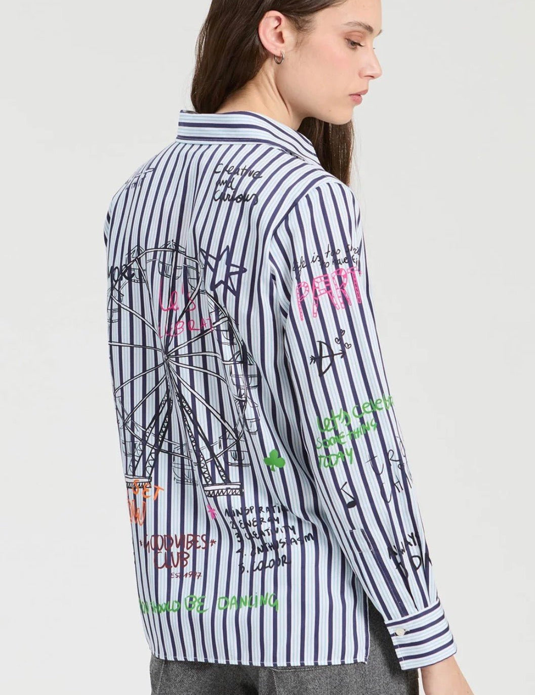 Back view of the Printed Striped Shirt, a blue stripe shirt with whimsical doodle print