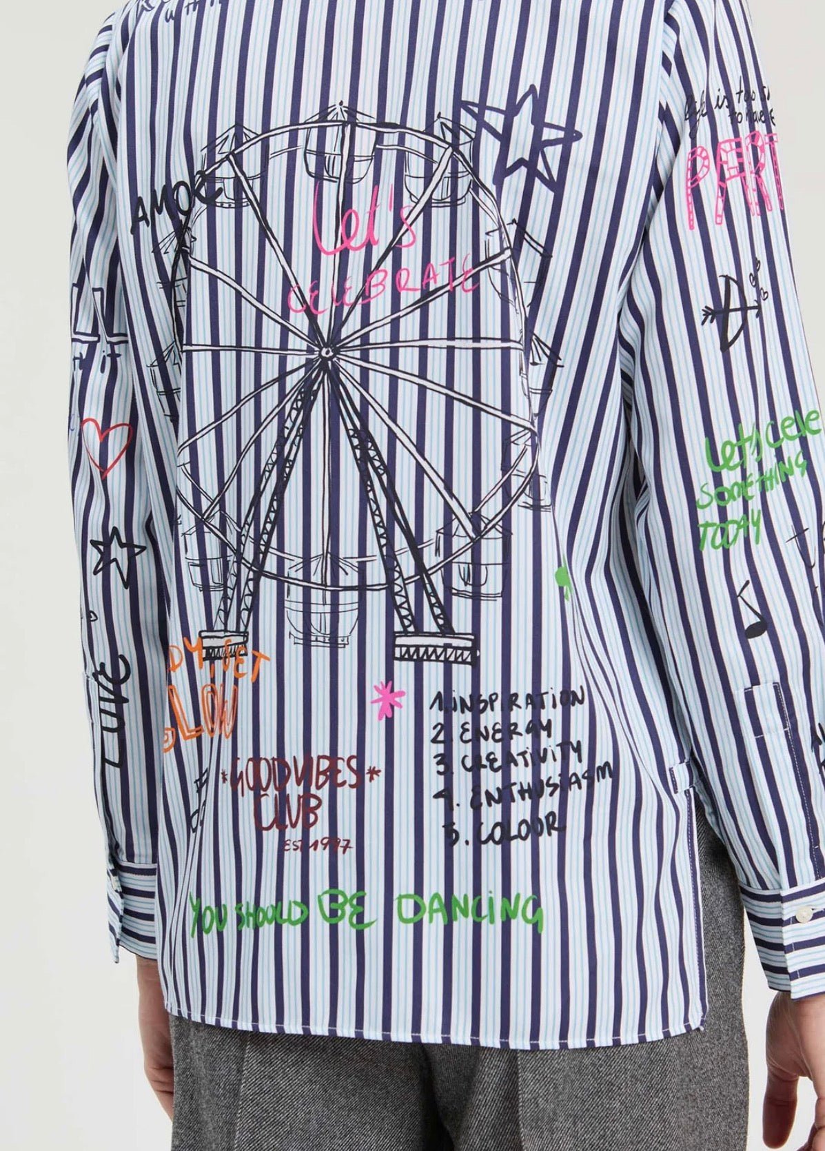 Printed Striped Shirt styled on model, a blue stripe shirt with whimsical doodle print – Lady & Tucker