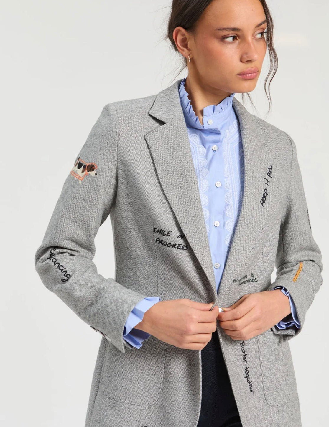 Light Gray Printed Jacket, a gray herringbone printed blazer, worn front view