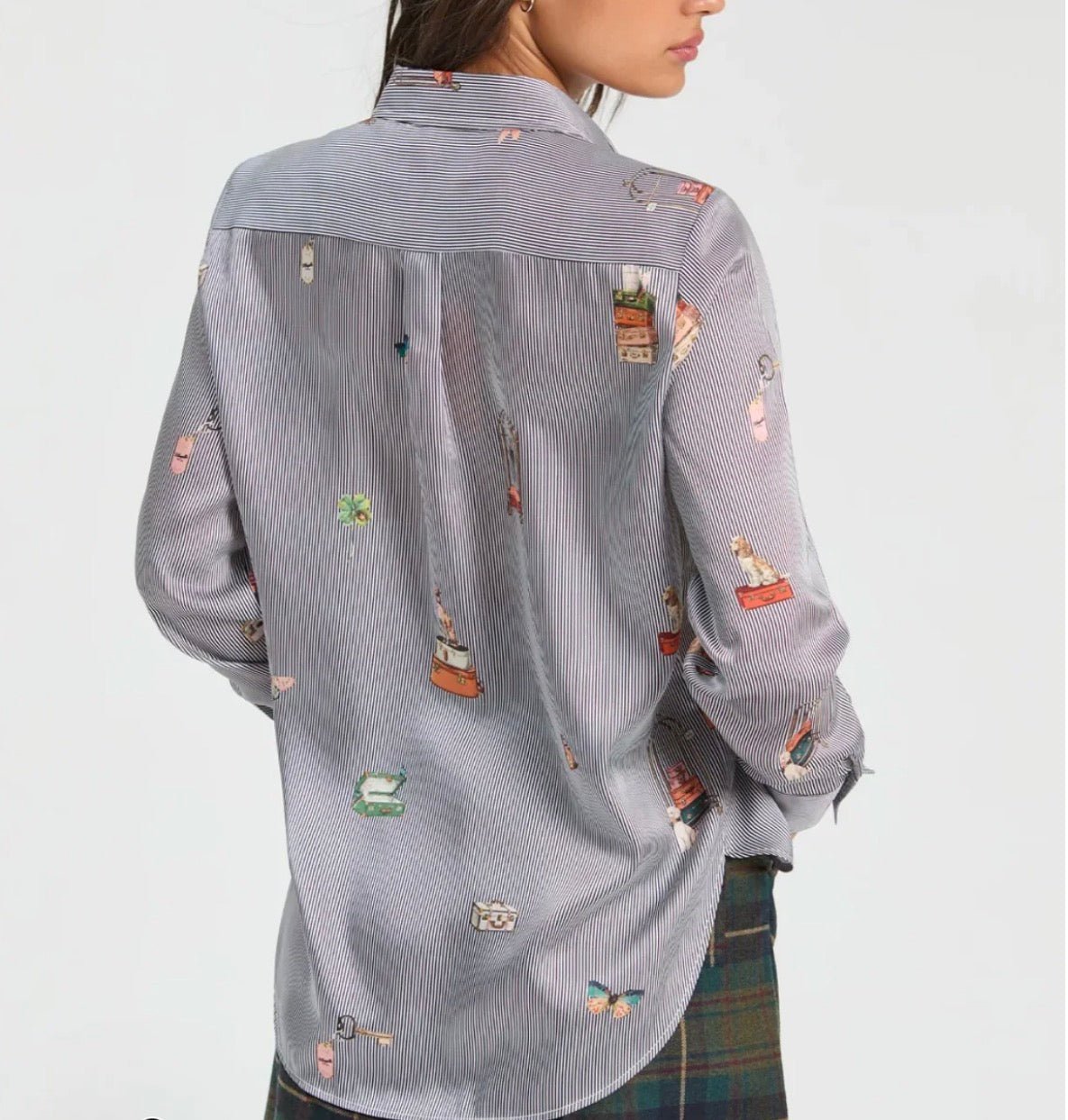Close-up of the travel-inspired embroideries on the Hotel Striped Shirt – Lady & Tucker