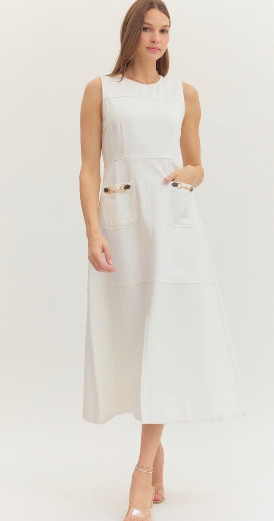 Preppy In White Dress, a white sleeveless midi with horsebit pockets, worn front view
