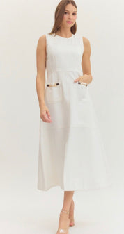 Preppy In White Dress, a white sleeveless midi with horsebit pockets, worn front view