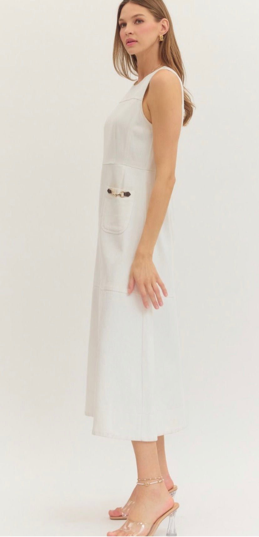 Back view of the Preppy In White Dress, a white sleeveless midi with horsebit pockets